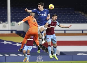 West Ham’s goalkeeper Darren Randolph bats the ball clear away from Everton’s Seamus Coleman.