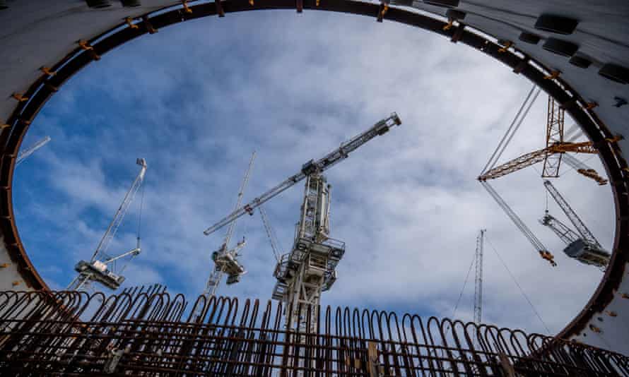 A crane moves building materials into the circular reinforced concrete and steel home of a reactor at Hinkley Point C nuclear power plant in Somerset.