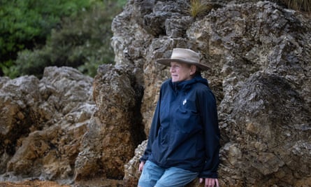Alison Lester, pictured in South Gippsland in Australia sitting on a rock