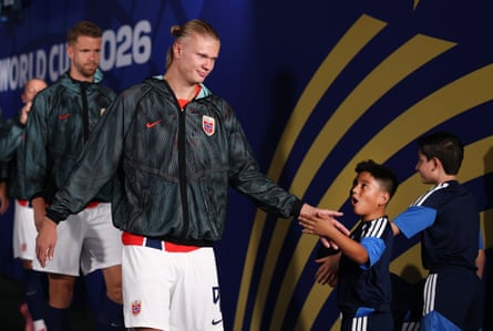 Erling Haaland of Norway precocious fives 1 of the World Cup walkout mascots up of the last-16 lucifer against Brazil.