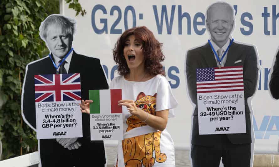 An activist and two cardboard cutouts