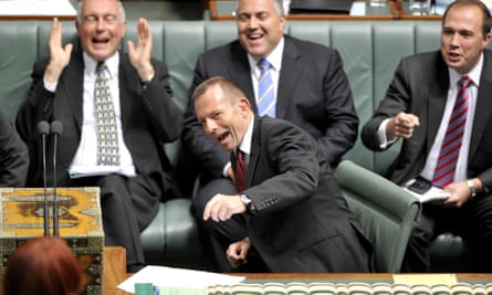 (L to R) Opposition members Warren Truss, Joe Hockey, Tony Abbott (front) and Peter Dutton react to Prime Minister Julia Gillard during House of Representatives question time, Monday, 22 November, 2010.