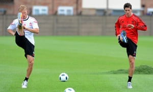 Fernando Torres (right) and Dirk Kuyt take part in their first Liverpool training session after returning from the World Cup, where they faced each other in the 2010 final.