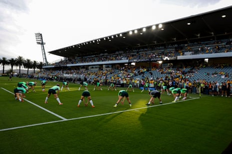 Australia's players warm up at Polytec Stadium.