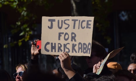A protester holding up a placard reading 'justice for Chris Kaba'