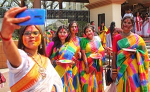 Women mark the festival in Dhaka, Bangladesh, at the Dhakeshwari national temple.