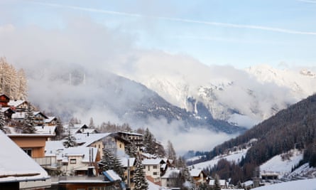 Rooftops and misty, snowy mountains at St Anton am Arlberg