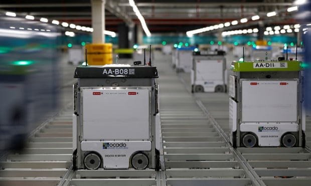 Ocado robots operating on the grid of the “smart platform” at the CFC (Customer Fulfilment Centre) in Andover