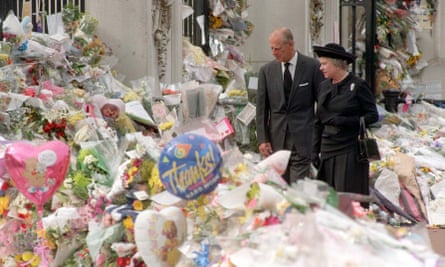 The Queen and the Duke of Edinburgh viewing the floral tributes left at Buckingham Palace after the death of the Princess of Wales in 1997.