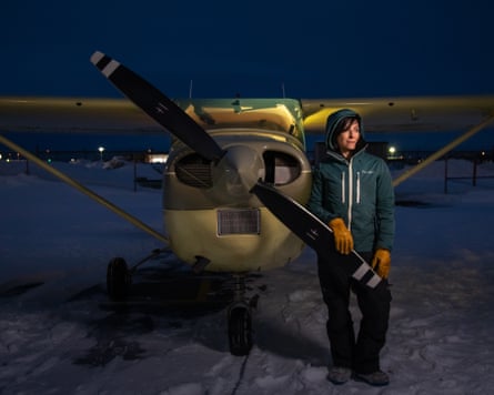 Jamie Klaes, 41, originally from Bettles, a small village 35 miles above the Arctic Circle, with her Cessna 182 in Anchorage, Alaska.