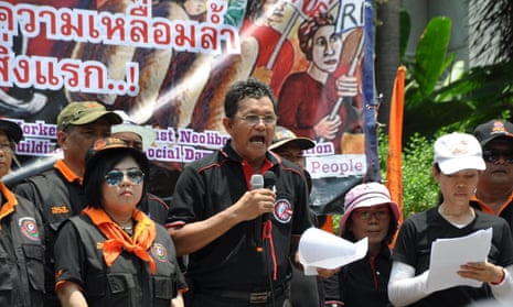 Sawit Kaewvarn, president of the rail workers’ union in Thailand, speaking at a union rally