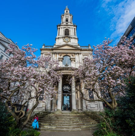 St Mary le Strand church flanked by trees in blossom.