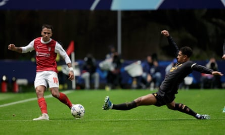 Jude Bellingham throws himself into a tackle against Braga