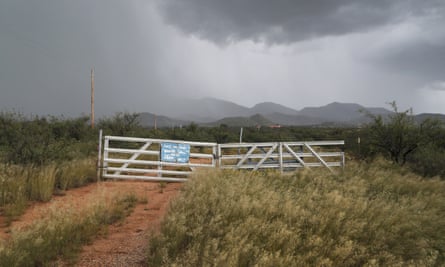 A rainstorm rolls in as a gate bars passerby from entry on 29 September 2016 near the US-Mexico border in Arizona.