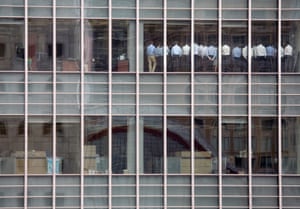 The US bank Lehman Brothers was on the brink, I was in Reuters London newsroom and I noticed several reporters peering at the skyscraper opposite. I knew the building opposite was the Lehman building, so I grabbed my camera and ran across. The bank’s staff were lined up with their backs to the window, and I took some pictures with a 70–200mm lens. I didn’t realize the significance of the scene until I walked back and checked our systems, which showed the Lehman share price still dropping