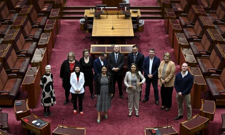 The president of the Senate Slade Brockman and newly elected senators pose for photographs during a seminar in the Senate chamber at Parliament House in Canberra on 21 July.