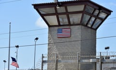 A watchtower at the Guantánamo Bay base in Cuba, with a US flag sign fixed to the wall