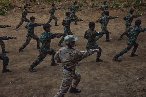 CNDF soldiers participate in martial arts training under the guidance of Mai Zacer Mawi at afacility in Falam township, Chin state.
