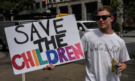 A demonstrator wears a T-shirt with a QAnon slogan in New York. The ‘Save Our Children’ version of the conspiracy theory offers a decidedly softer aesthetic and rhetorical appeal.