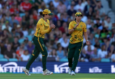 South Africa's Laura Wolvaardt (left) after taking the catch of England's Heather Knight.