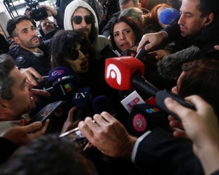 Gianinna Maradona surrounded by reporters arrives at the court
