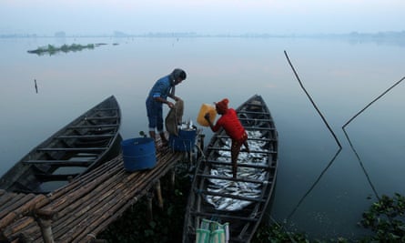 Fishermen collect fish