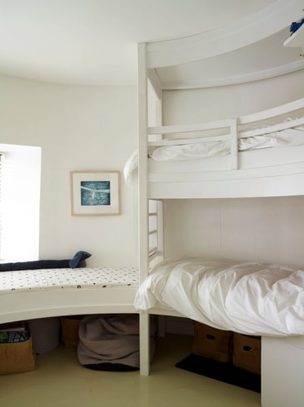 Sleep well: bunk beds built to follow the curve of the lighthouse’s ancient walls.