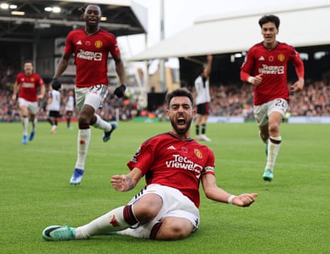 Manchester United’s captain Bruno Fernandes celebrates scoring the opening goal during stoppage time at Fulham.