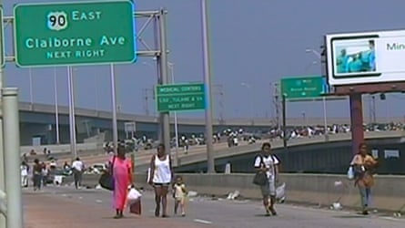 People walking on a highway.