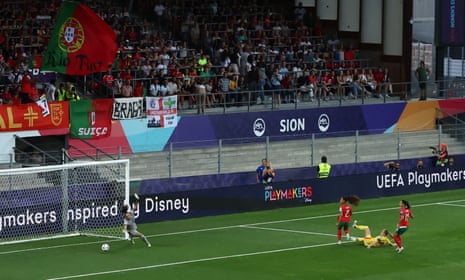 Belgium's Tessa Wullaert scores their first goal past Portugal's keeper Patricia Morais.