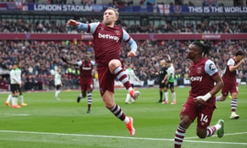 Jarrod Bowen leaps in celebration after giving the Hammers a half-time lead over Liverpool.