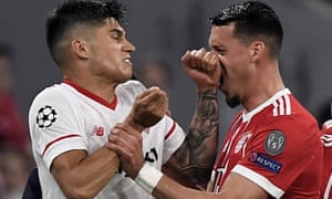 Joaquin Correa (left) clashes with Bayern’s Sandro Wagner and the Sevilla player was sent off late on.