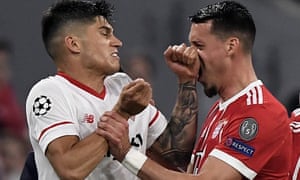 Joaquin Correa (left) clashes with Bayernâs Sandro Wagner and the Sevilla player was sent off late on.