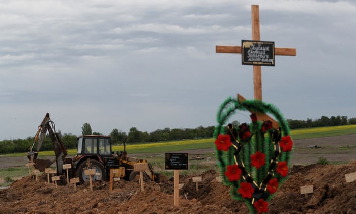A view shows newly-made graves at a cemetery in the course of Ukraine-Russia conflict in the settlement of Staryi Krym outside Mariupol, Ukraine May 22, 2022.