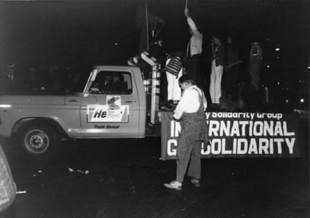 Police trying to remove Lance Gowland from truck during the first Mardi Gras.