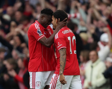 Taiwo Awoniyi of Nottingham Forest with Morgan Gibbs-White of Nottingham Forest celebrate after scoring a goal to put Nottingham Forest 3-0 ahead during the Premier League match with Chelsea at Stamford Bridge Stadium, London, England, on May 4.