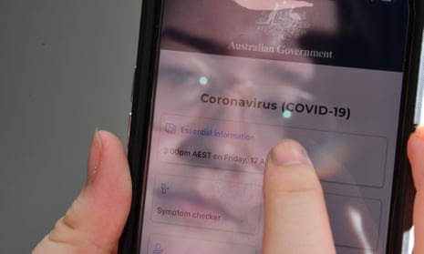 A person is seen using the Australian government Covid-19 app on an iPhone