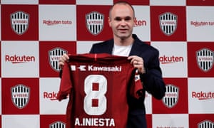 Andrés Iniesta poses with a Vissel Kobe shirt after signing for the club. âMy family is excited to come to Japan,â he said.