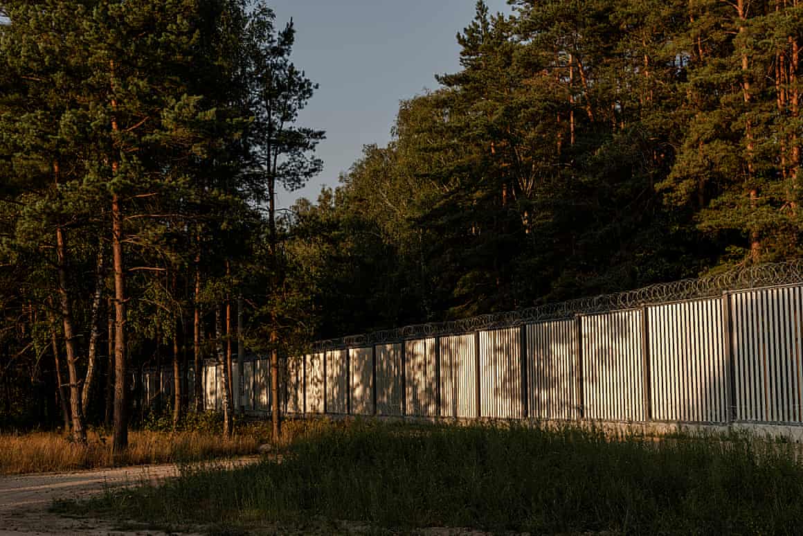A border wall enforced by barbed wire