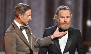 Actor Tony Goldwyn admires the hirsute Bryan Cranston as they present an award.