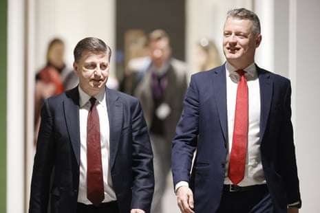 Pollard and Alexander walking side by side.