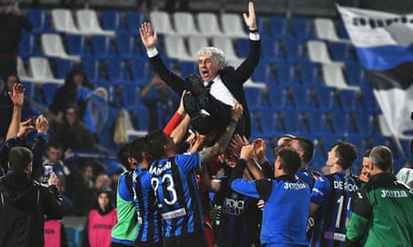 Atalanta’s head coach Gian Piero Gasperini is tossed in the air by his players as they celebrate.