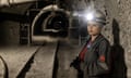 A woman in a coal mine tunnel in Ukraine.
