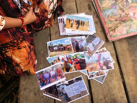 Photos spread over a wooden table