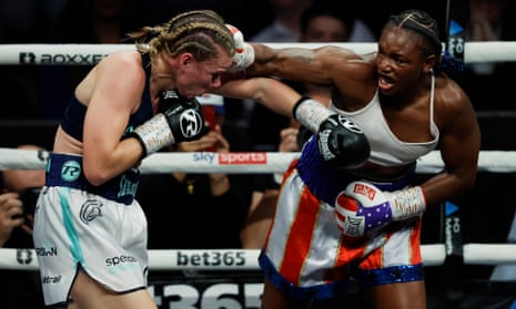 Claressa Shields (right) punches Savannah Marshall (left) during their IBF, WBA, WBC, WBO World Middleweight Title fight.