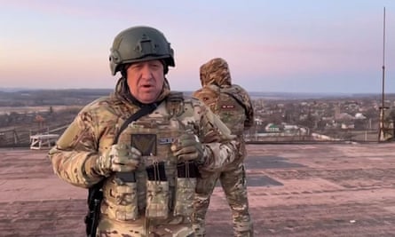 Yevgeny Prigozhin, the head of the Russian paramilitary group Wagner, speaking to a camera from a rooftop at an undisclosed location