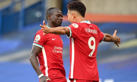 Liverpool’s Sadio Mane [left] celebrates scoring.