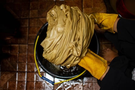 Workers are carrying out the process of dyeing fabrics using natural dyes in Lhokseumawe, Aceh Province, Indonesia, on January 11, 2023.