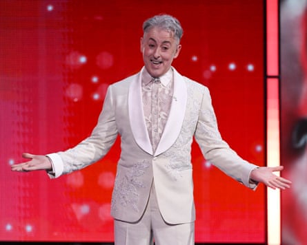 Reference … host Alan Cumming speaks from the stage.