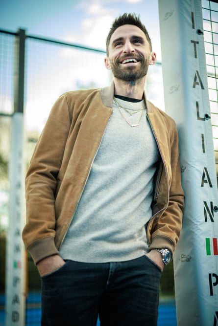 Fabio Borini by the Italian Padel courts he has helped to build at Worsley Sports Club.